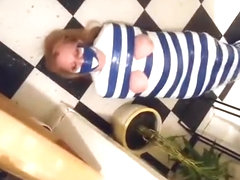 Duct tape mummy girl struggles through apartment