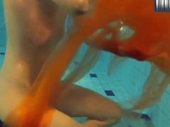 Yellow And Red Clothed Teen Underwater