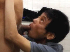 Japanese gay helping friend to cum in the public bathroom