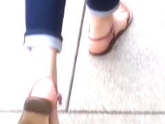 Redhead chick's natural feet in sandals