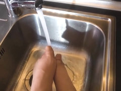 Anastasia De Vine is rubbing her hairy pussy in the kitchen and moaning from pleasure while cumming