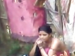 Topless Indian wife washes herself
