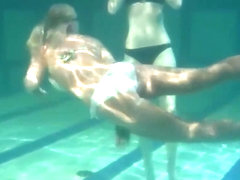 Retro footage of two underwater lesbians