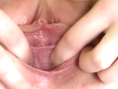 Sultry nympho is gaping soft cunt in closeup and having orga